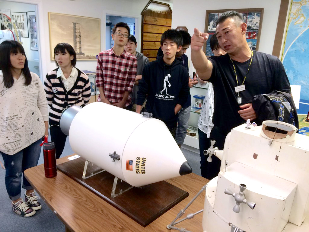 Guests examine exhibits at the American Space Museum.